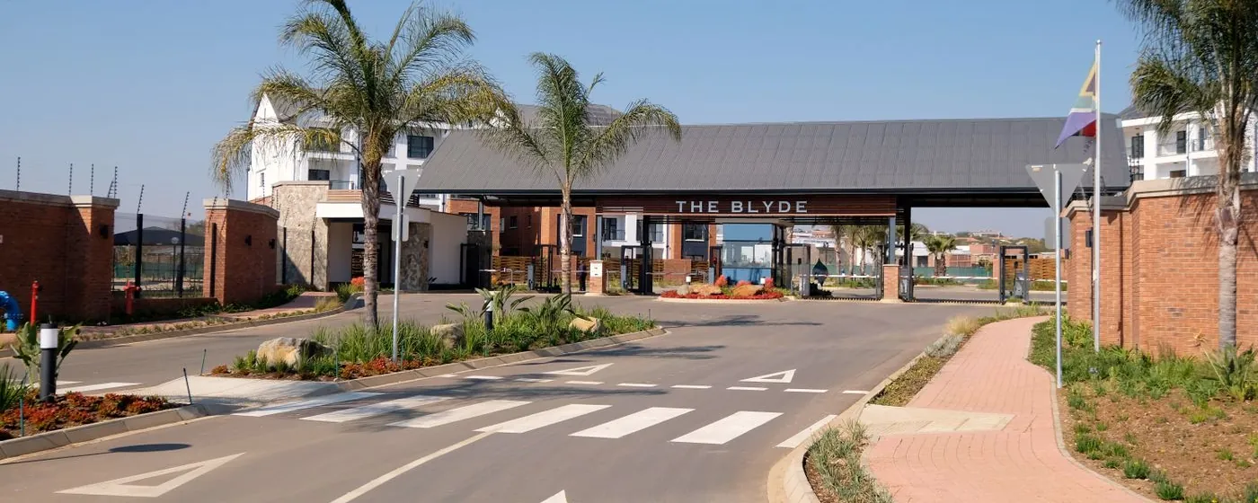Stock photo: the entrance road and gatehouse of a residential complex